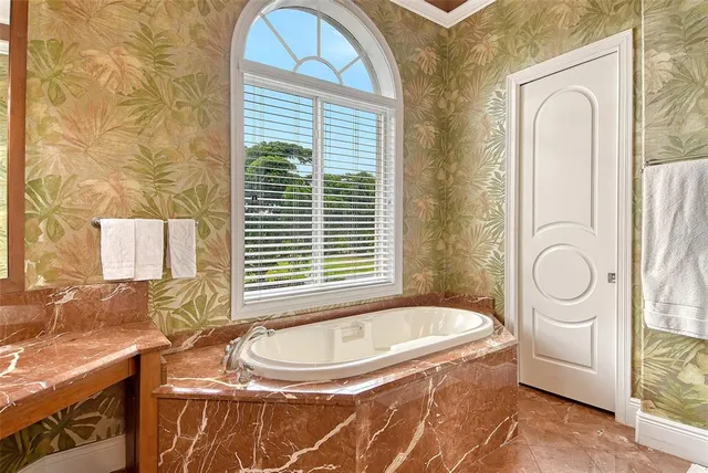 a bathroom with a sink vanity and a mirror