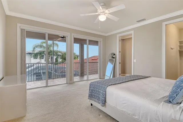 a bedroom with two beds and a window