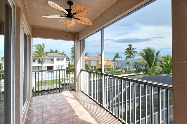 a spacious bedroom with two beds and a chandelier