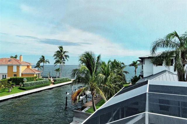 a bathroom with a granite countertop sink and a mirror with toilet