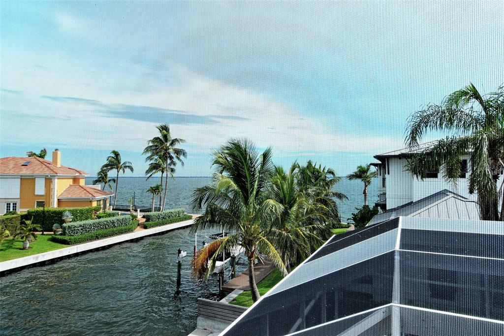 591 Putting Green Lane Longboat Key, FL 34228 - Photo 39 of 68 a view of a house with a swimming pool