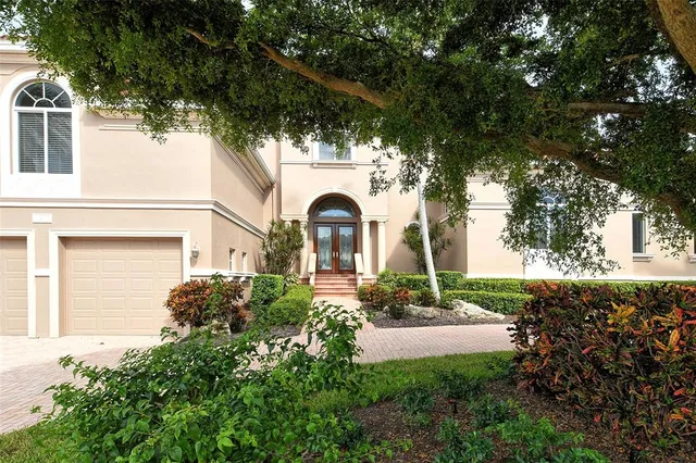 a living room with furniture and large windows