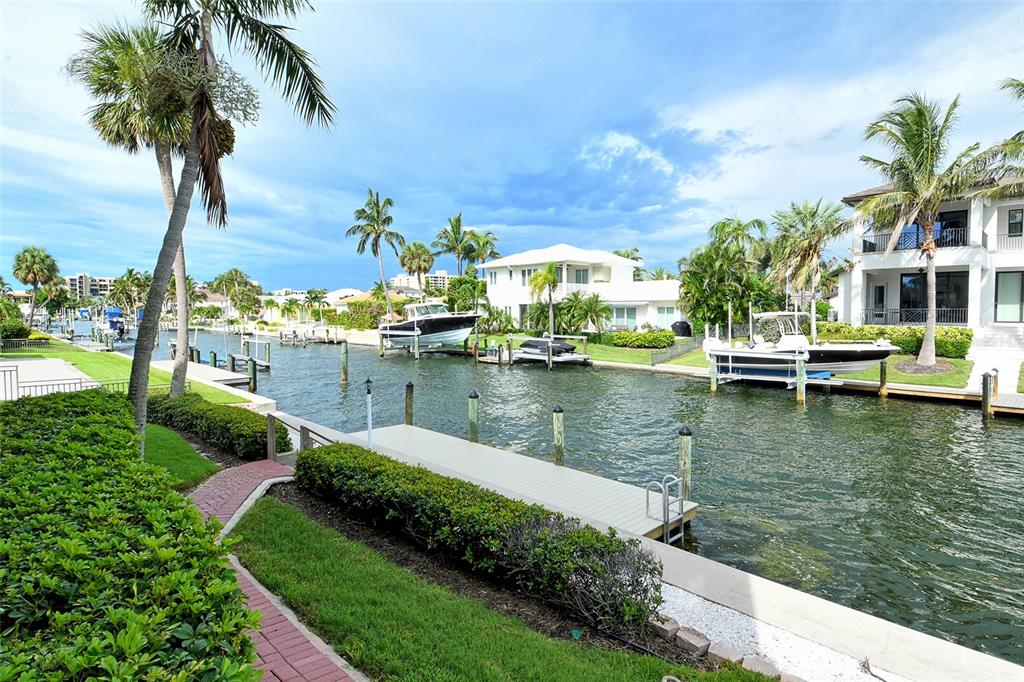 591 Putting Green Lane Longboat Key, FL 34228 - Photo 63 of 68 a view of a lake with a house