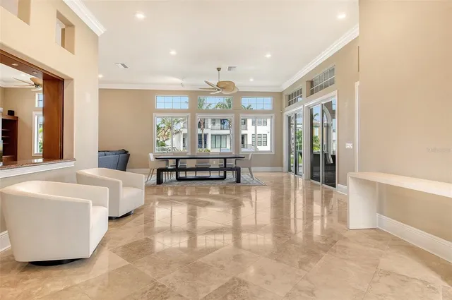 a view of a living room and kitchen with a table or chairs