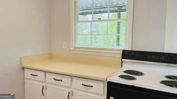a view of storage and utility room with washer and dryer