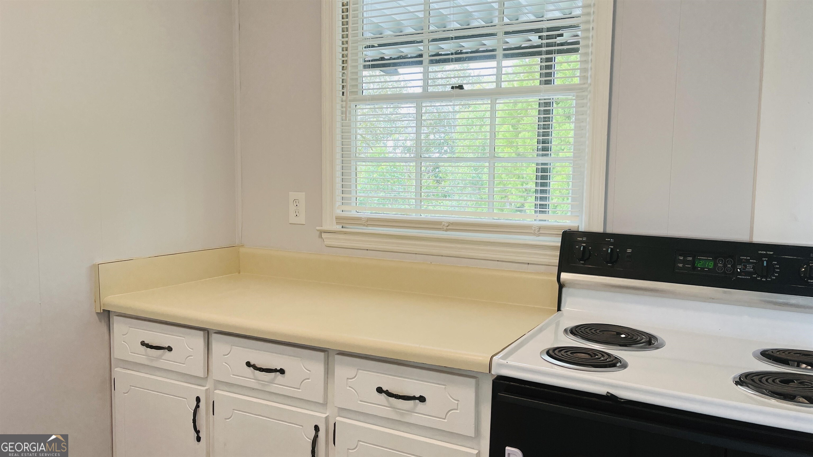 601 West Haralson Street, Unit 10 LaGrange, GA 30240 - Photo 8 of 11 a view of storage and utility room with washer and dryer