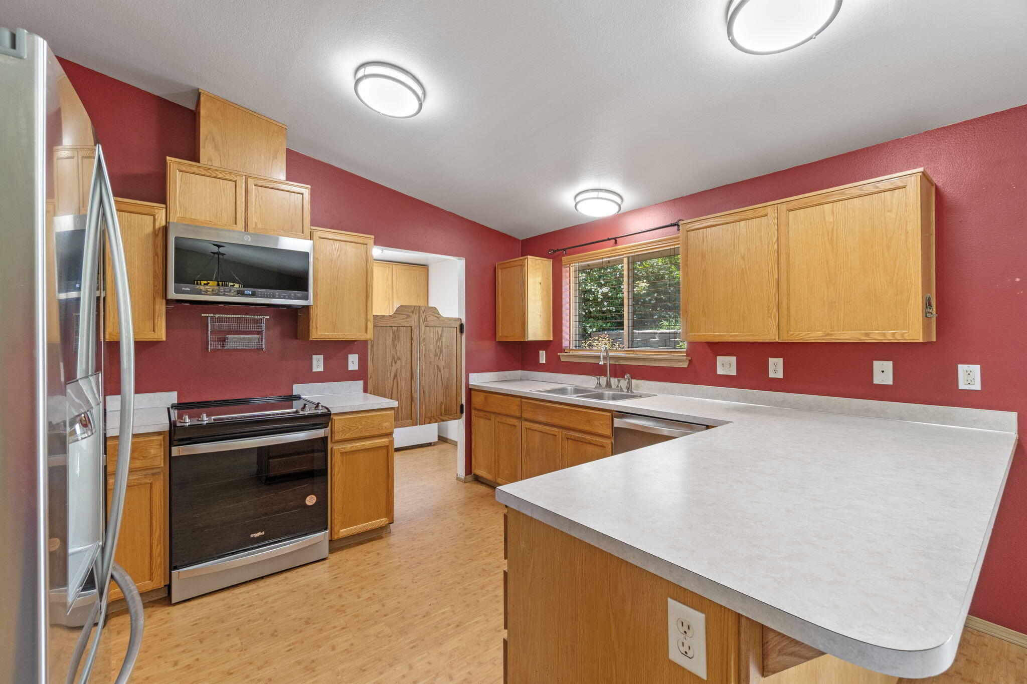 2630 Frontage Road Klamath Falls, OR 97601 - Photo 33 of 72 a kitchen with stainless steel appliances a stove sink and cabinets