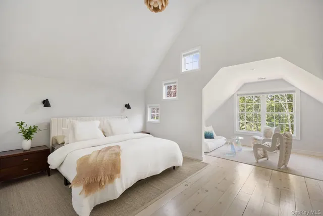 a bed room with a bed and a large window