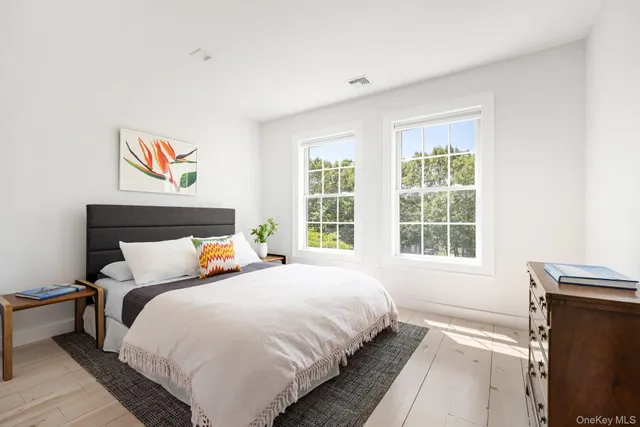 a bedroom with bed and a window