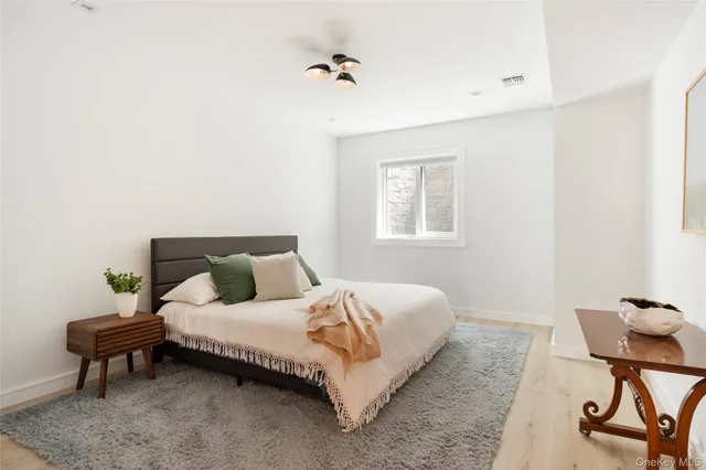 a bedroom with a bed and a table in it