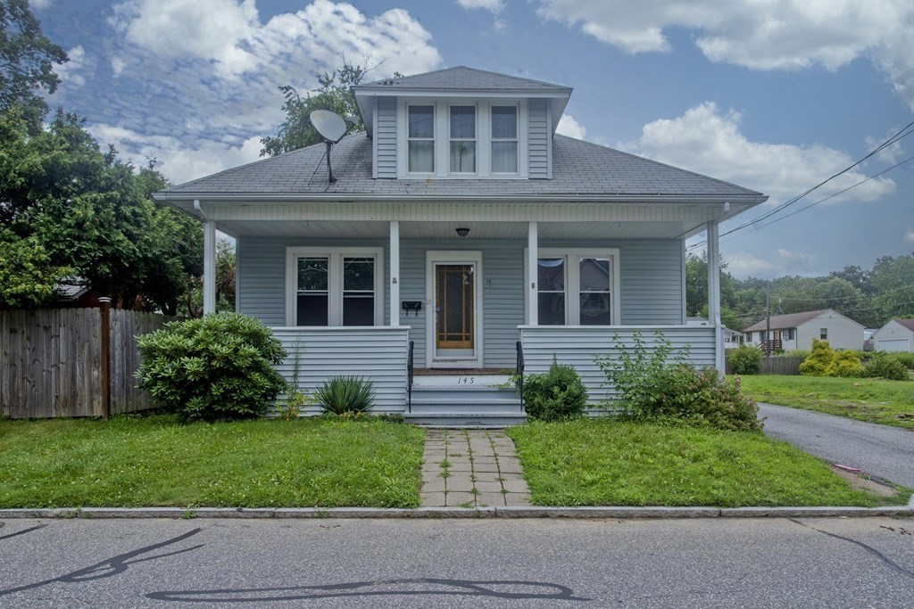 145 Carr Street Springfield, MA 01118 - Photo 1 of 41 a front view of a house with a garden