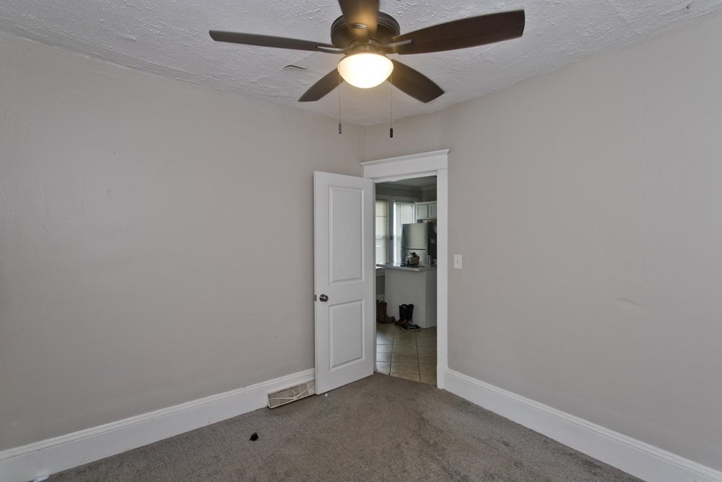 145 Carr Street Springfield, MA 01118 - Photo 23 of 41 an empty room and a chandelier fan in a room