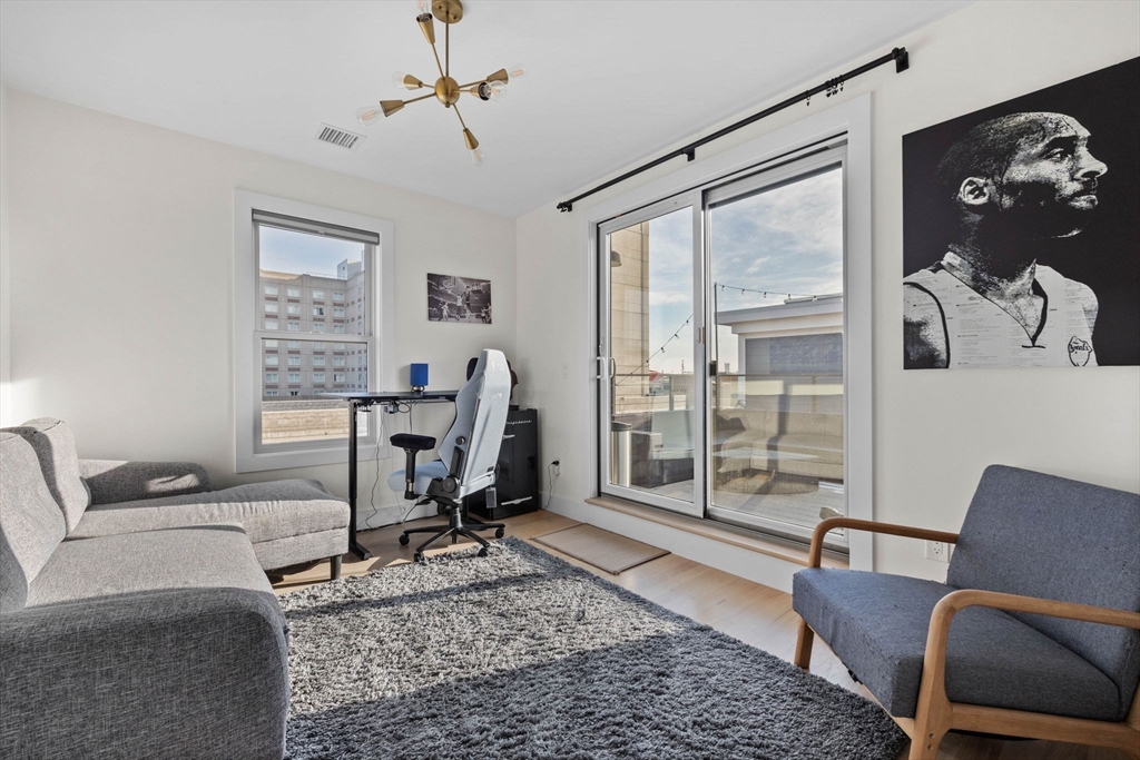161 Cottage Street, Unit 9 Boston, MA 02128 - Photo 11 of 26 a view of a livingroom with workspace and a couch