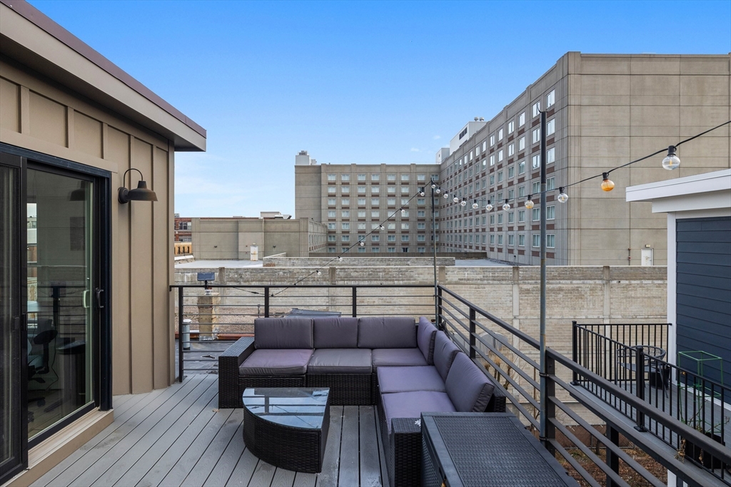161 Cottage Street, Unit 9 Boston, MA 02128 - Photo 15 of 26 a balcony view with a seating space