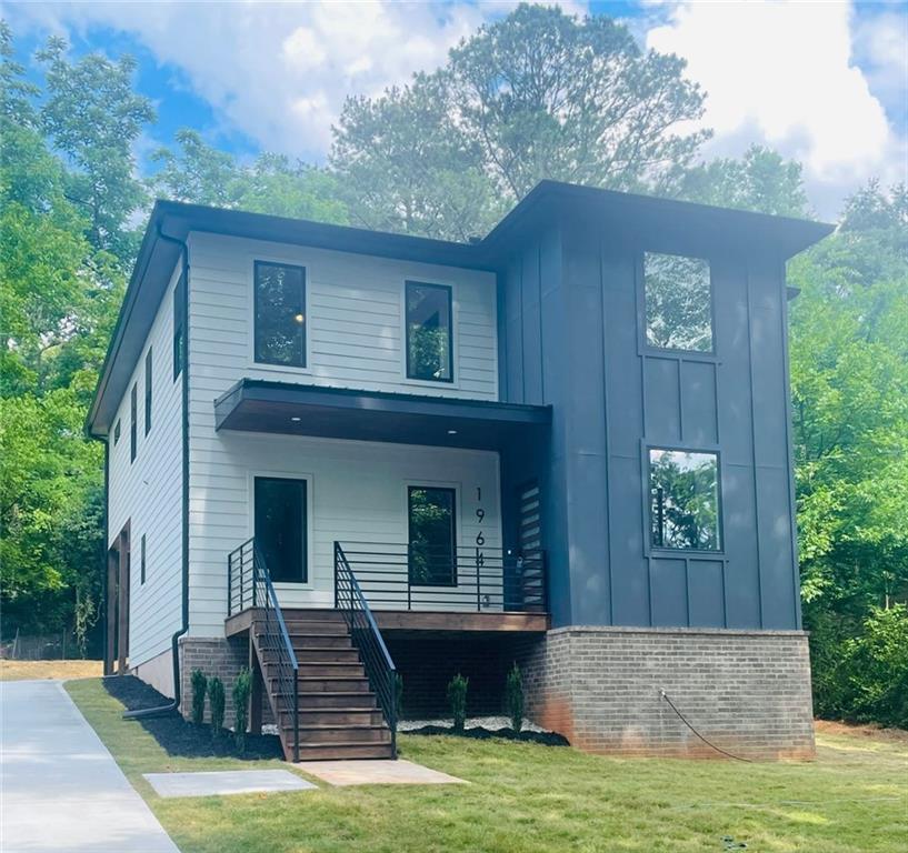 1964 McAfee Place Decatur, GA 30032 - Photo 1 of 1 a front view of a house with garden