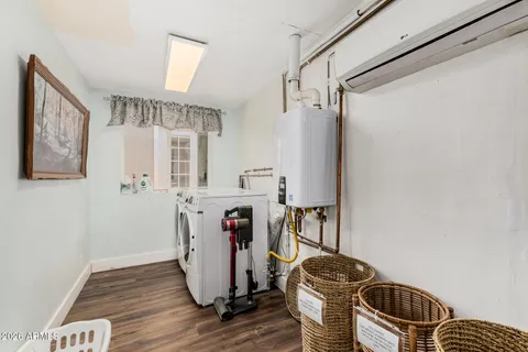 a view of a patio with table and chairs with wooden floor and fence