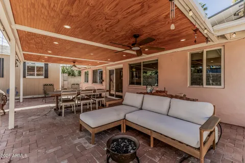 a living room with lots of furniture and a chandelier