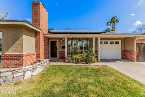 a view of kitchen with stainless steel appliances granite countertop a refrigerator and a sink