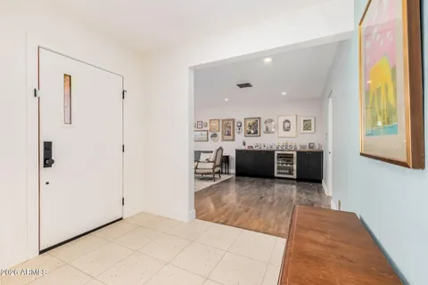 a view of a livingroom with furniture window and wooden floor