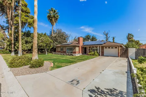 a kitchen with stainless steel appliances a refrigerator sink and cabinets