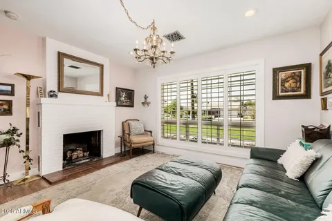 a living room with granite countertop furniture and a fireplace