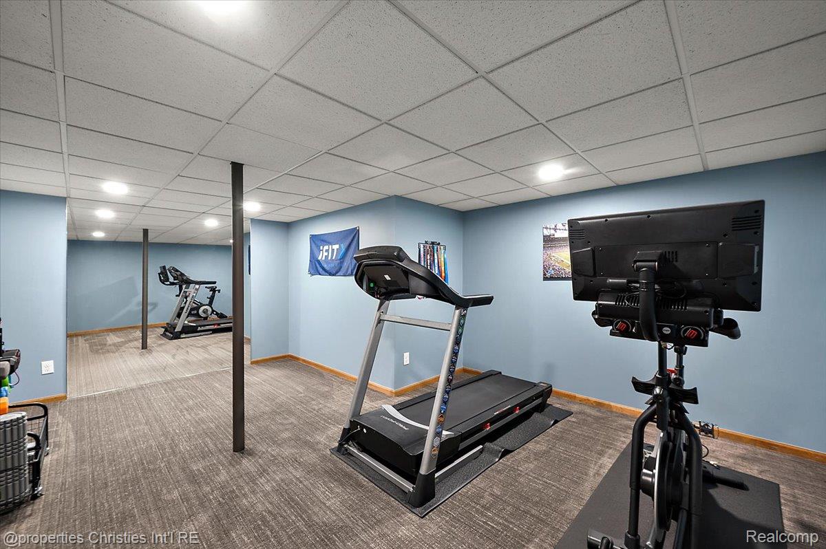 1071 Woodbridge Lane Rochester, MI 48306 - Photo 57 of 76 Exercise area with a drop ceiling, carpet, and recessed lighting