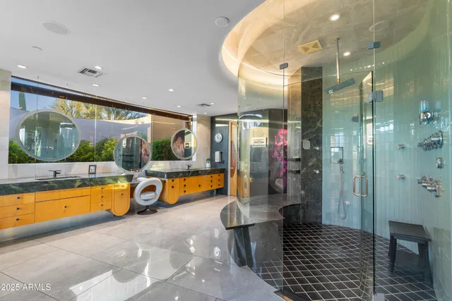 a spacious bathroom with a tub and shower