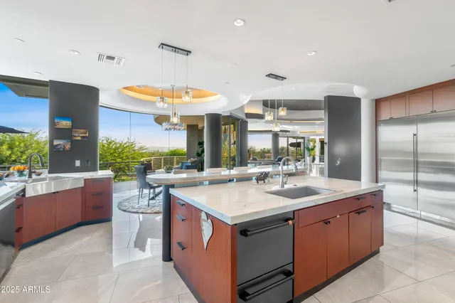 a kitchen with a sink appliances and a counter top space
