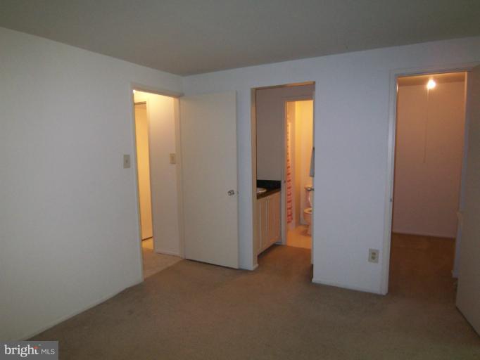 11080 Saffold Way Reston, VA 20190 - Photo 13 of 30 an empty room with windows and closet