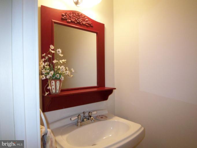 11080 Saffold Way Reston, VA 20190 - Photo 15 of 30 a bathroom with a sink and a mirror