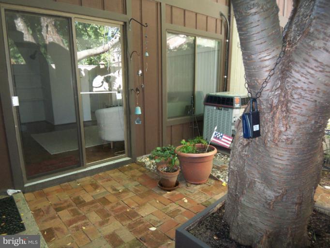 11080 Saffold Way Reston, VA 20190 - Photo 24 of 30 a room with water heater and outdoor space