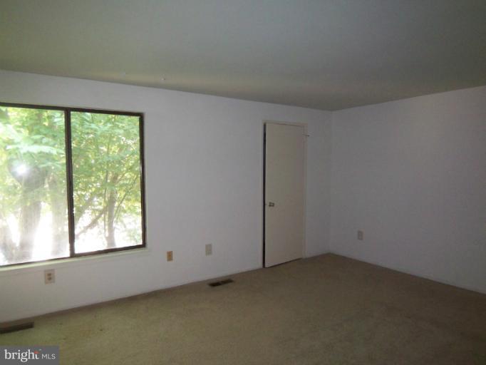 11080 Saffold Way Reston, VA 20190 - Photo 5 of 30 an empty room with a window