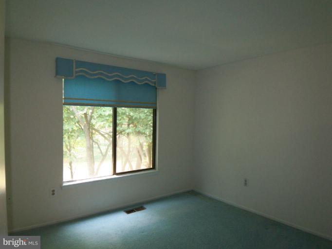 11080 Saffold Way Reston, VA 20190 - Photo 9 of 30 an empty room with a window