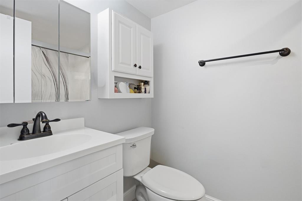 3910 Inverrary Boulevard, Unit 708B Lauderhill, FL 33319 - Photo 23 of 58 a bathroom with a sink a toilet and shower