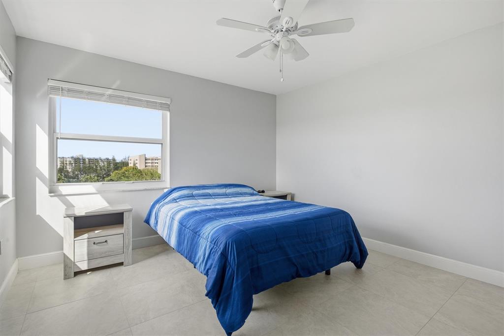 3910 Inverrary Boulevard, Unit 708B Lauderhill, FL 33319 - Photo 26 of 58 a bedroom with a bed and a window