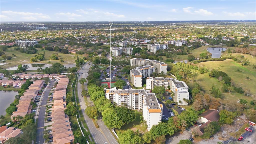3910 Inverrary Boulevard, Unit 708B Lauderhill, FL 33319 - Photo 42 of 58 an aerial view of residential houses with outdoor space