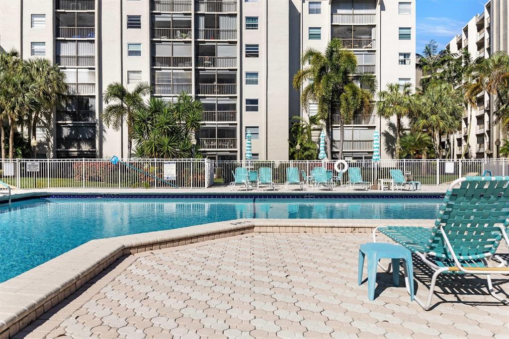 3910 Inverrary Boulevard, Unit 708B Lauderhill, FL 33319 - Photo 50 of 58 a view of swimming pool with outdoor seating and plants
