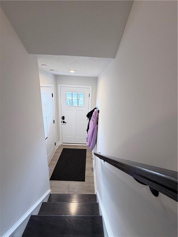 120 Crown Street McKees Rocks, PA 15136 - Photo 5 of 28 a view of entryway with stairs and wooden floor