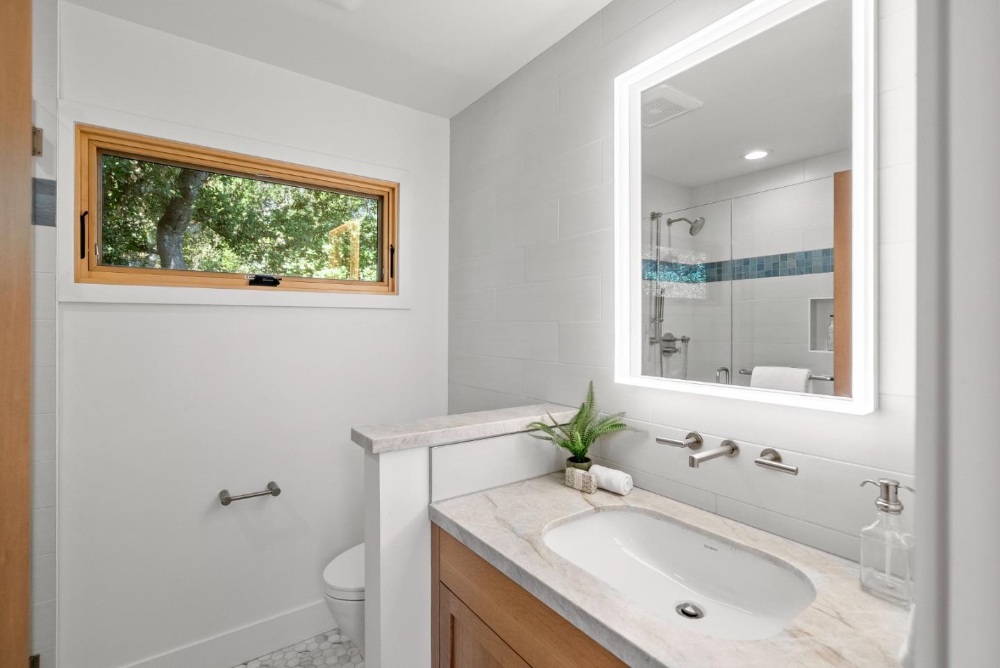 2201 Pullman Avenue Belmont, CA 94002 - Photo 17 of 48 a bathroom with a sink toilet and a mirror