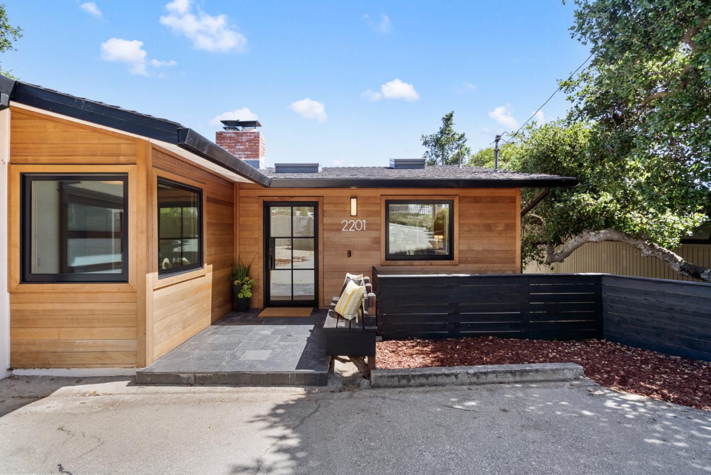 2201 Pullman Avenue Belmont, CA 94002 - Photo 2 of 48 a front view of a house with a yard