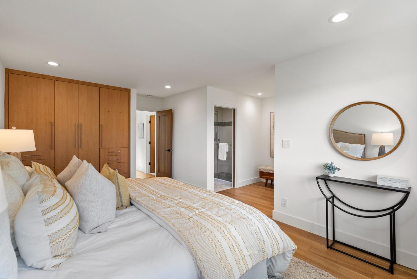2201 Pullman Avenue Belmont, CA 94002 - Photo 21 of 48 a bedroom with a bed a mirror and a table