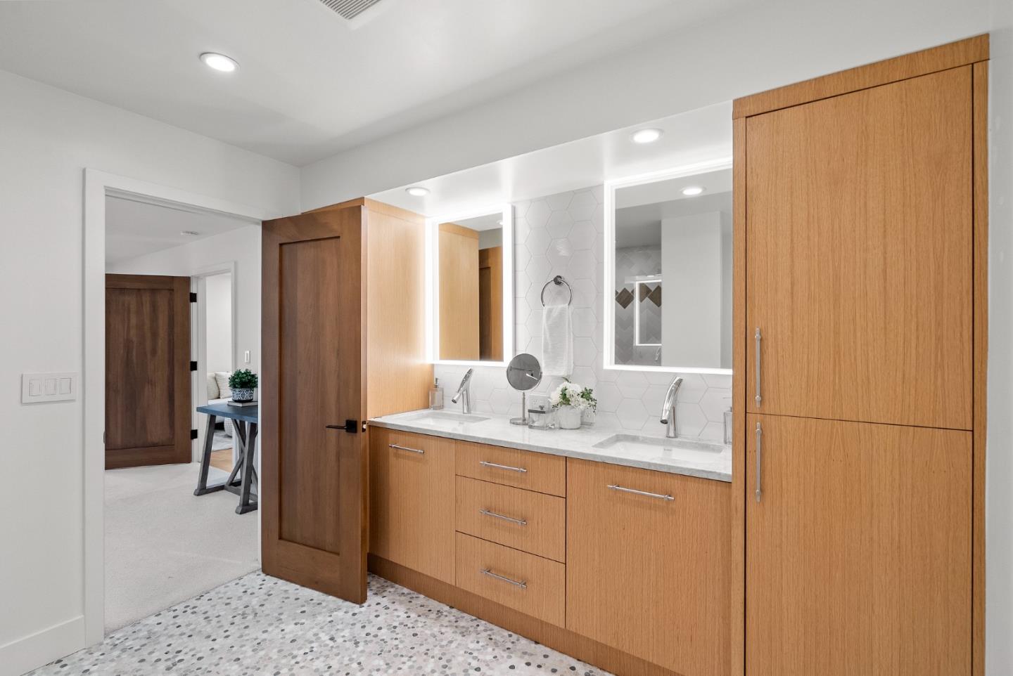2201 Pullman Avenue Belmont, CA 94002 - Photo 31 of 48 a en suite bathroom with a double vanity sink and mirror