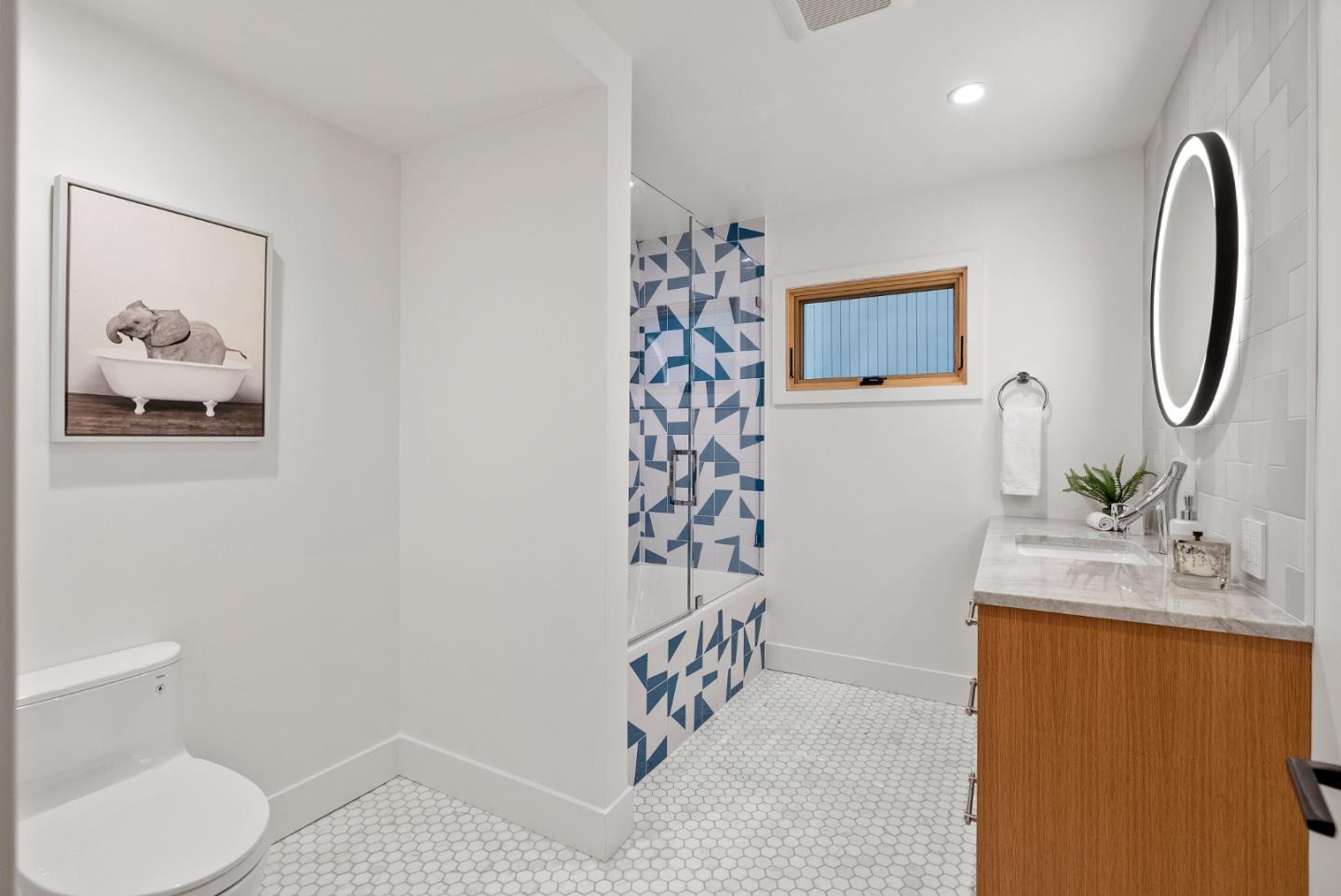 2201 Pullman Avenue Belmont, CA 94002 - Photo 35 of 48 a bathroom with a sink toilet and shower