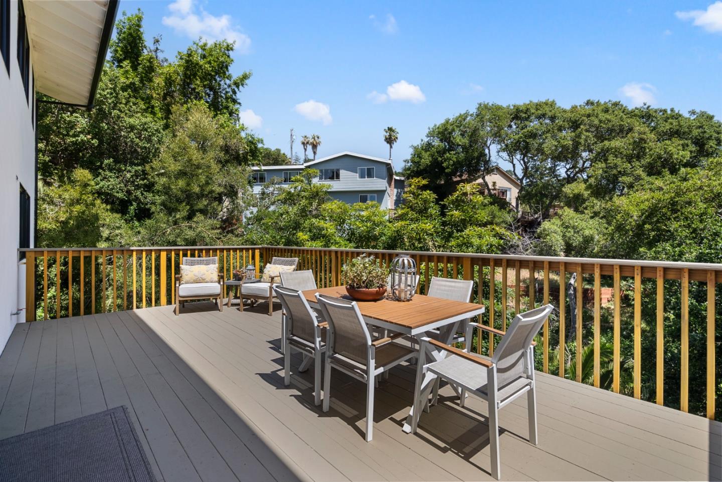 2201 Pullman Avenue Belmont, CA 94002 - Photo 39 of 48 a view of a chairs and table on the wooden deck