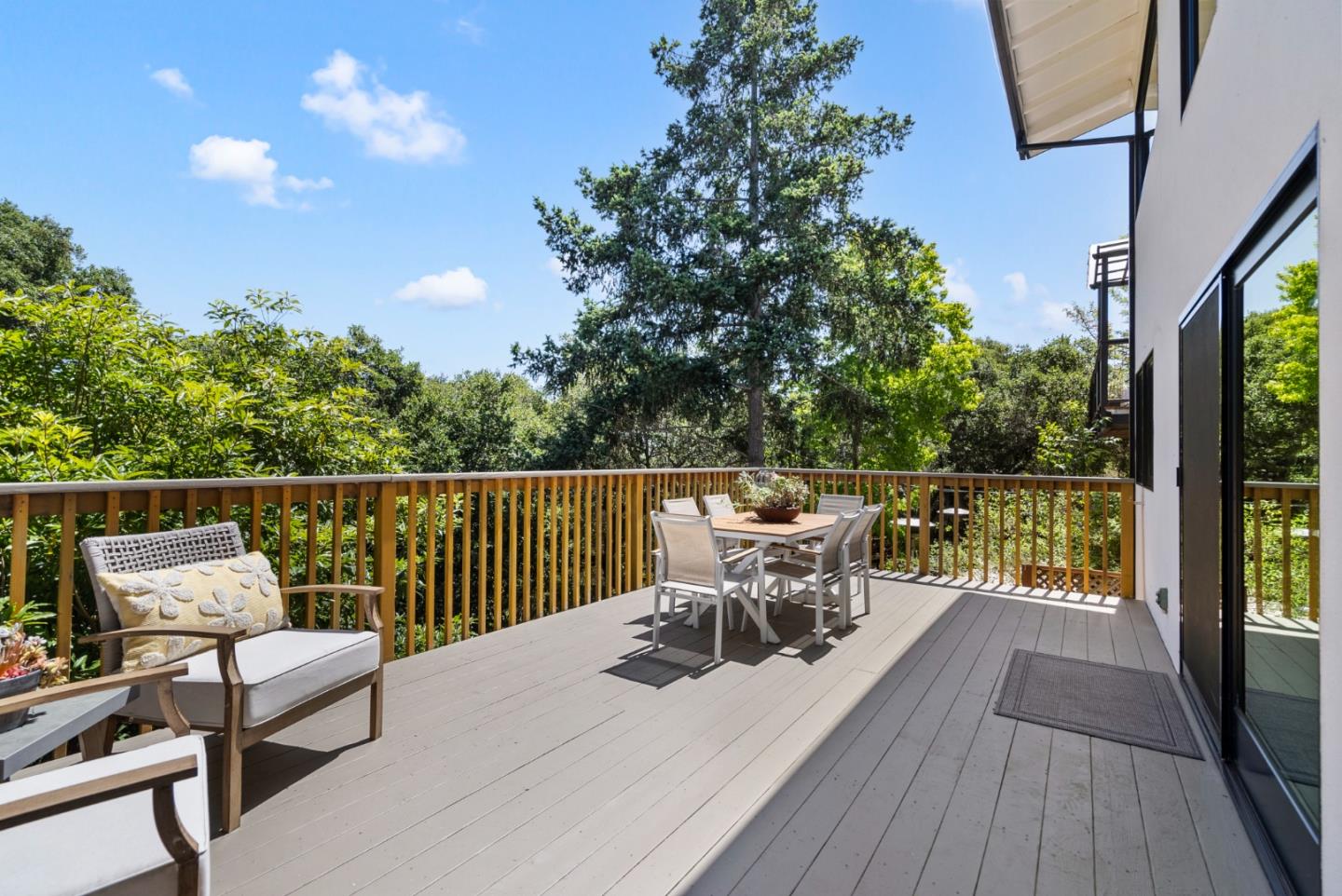 2201 Pullman Avenue Belmont, CA 94002 - Photo 40 of 48 a view of a chairs and table on the wooden deck