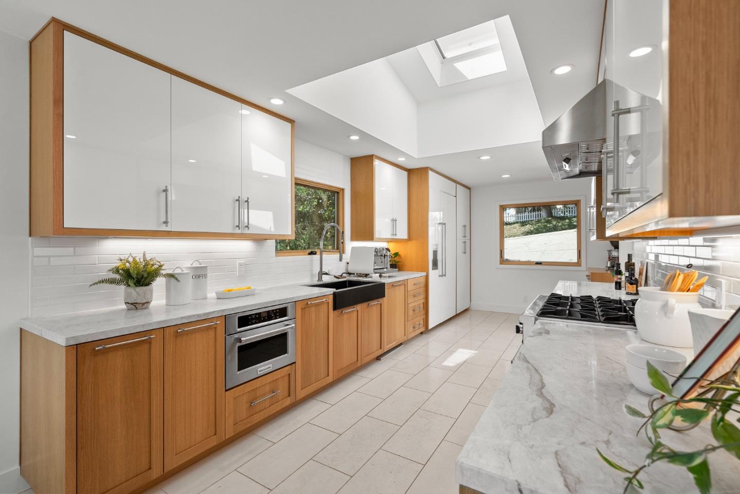 2201 Pullman Avenue Belmont, CA 94002 - Photo 7 of 48 a kitchen with stainless steel appliances granite countertop a stove a sink and a refrigerator