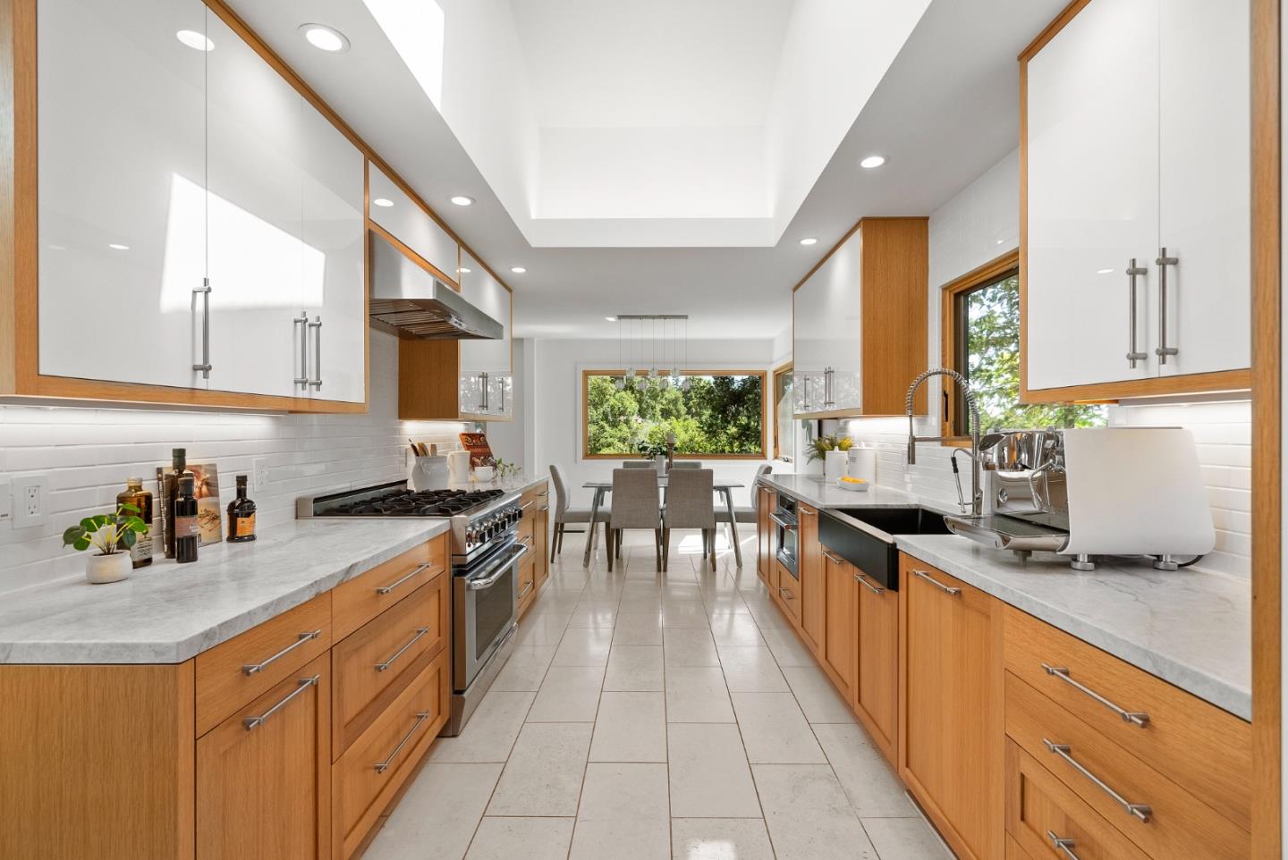 2201 Pullman Avenue Belmont, CA 94002 - Photo 10 of 48 a kitchen with stainless steel appliances granite countertop sink stove top oven and cabinets