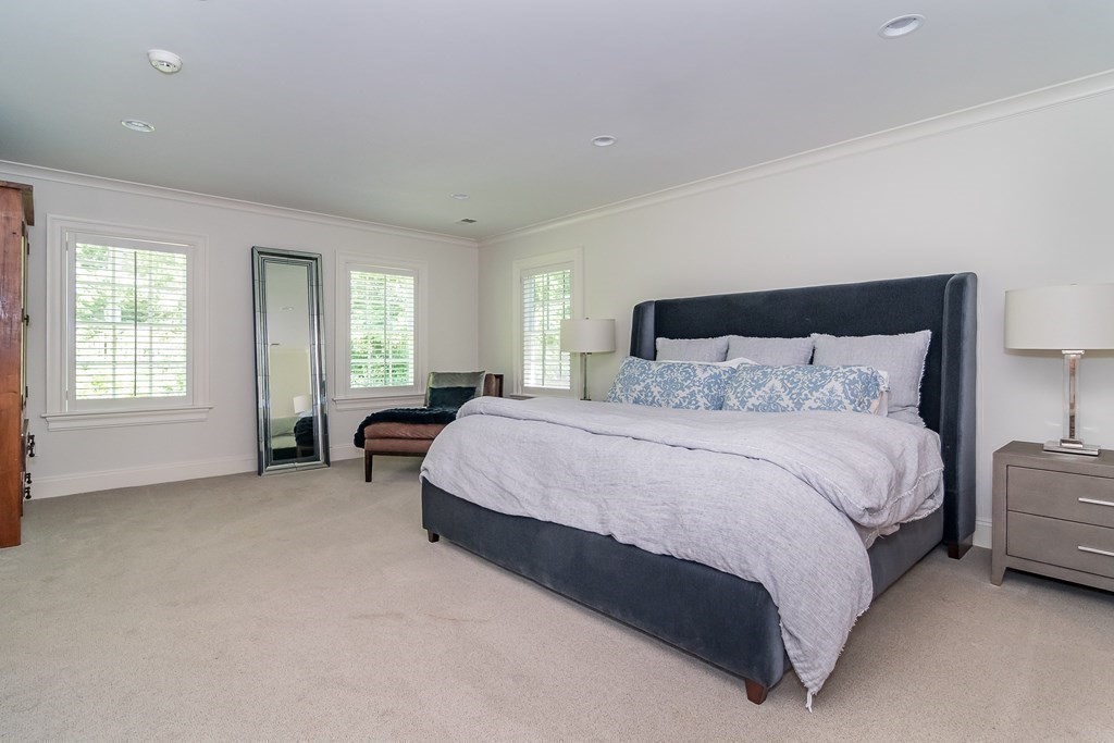 39 Temple Road Wellesley, MA 02482 - Photo 15 of 35 a spacious bedroom with a bed and a couch