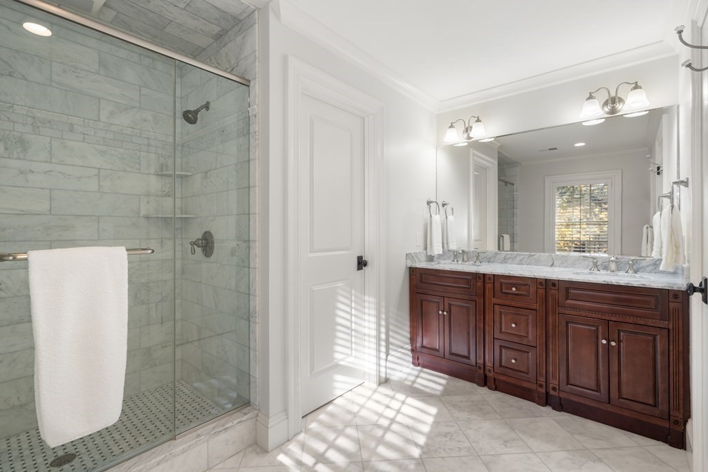 39 Temple Road Wellesley, MA 02482 - Photo 16 of 35 a spacious bathroom with a granite countertop sink a mirror and a shower