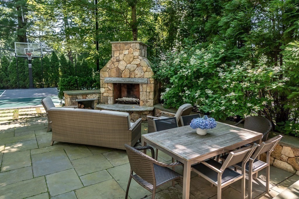 39 Temple Road Wellesley, MA 02482 - Photo 28 of 35 a view of a patio with table and chairs and potted plants